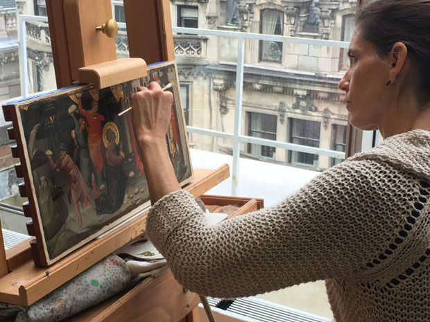 Student restoring a painting by Lorenzo di Niccolo