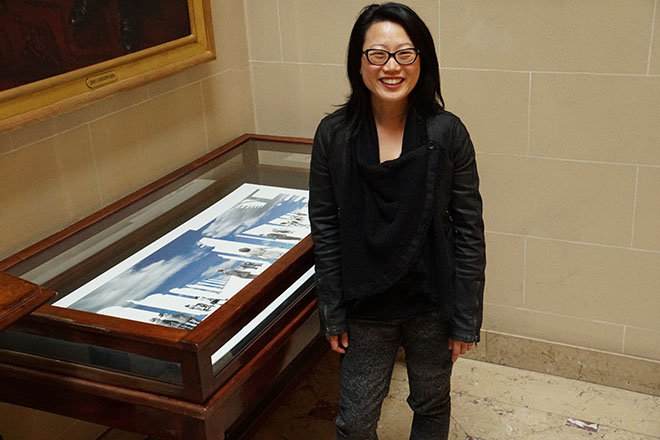 Photo of Jean Shin in front of her exhibition