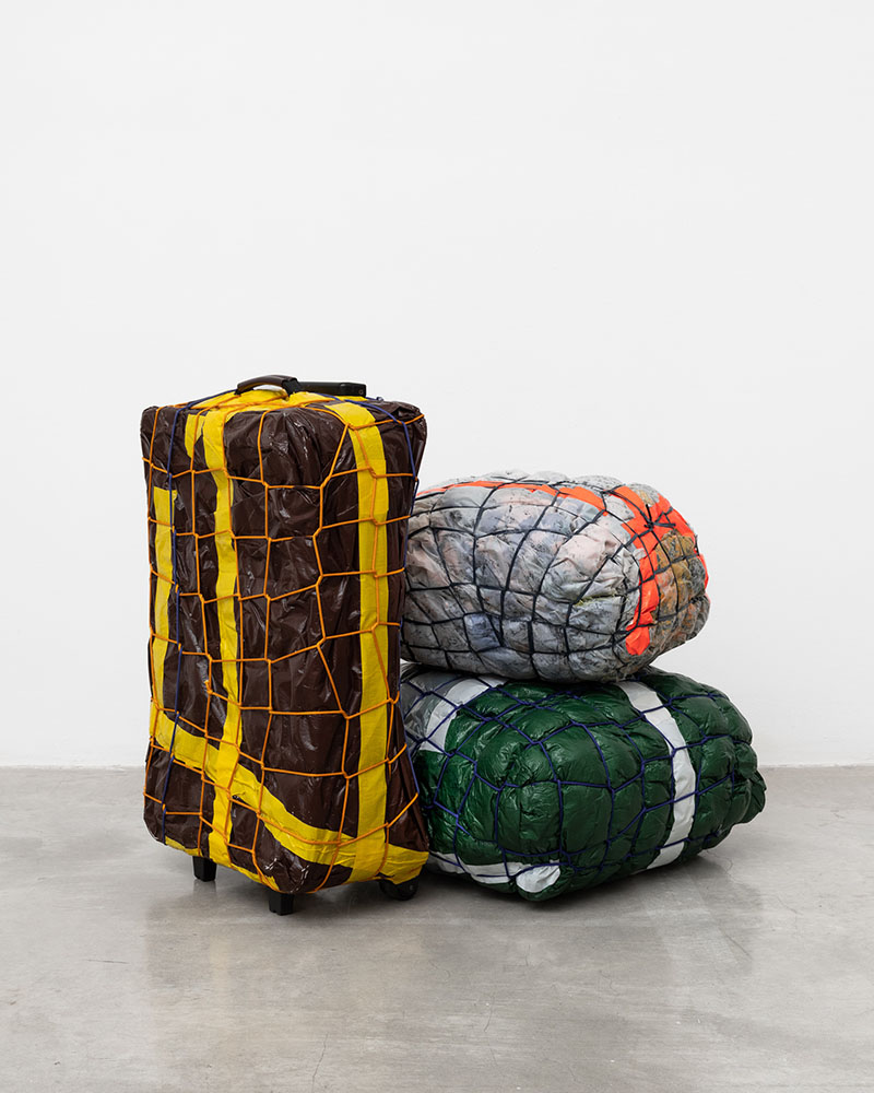 Pile of taped up luggage